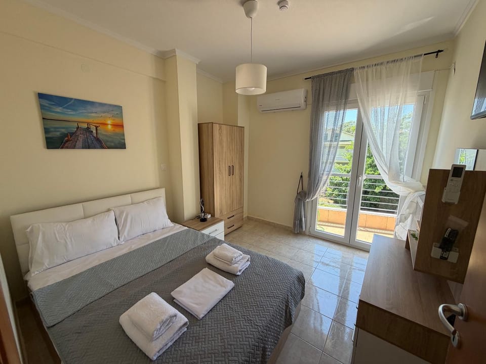 Bed, towels, wardrobe, air conditioner