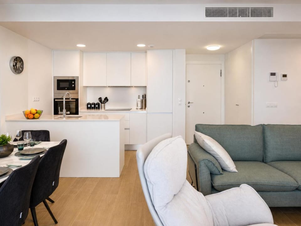 Living room, Dining area, microwave, oven, stove, kitchen, air conditioner
