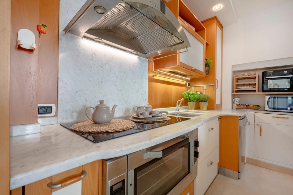 Kitchen or kitchenette, dishwasher, oven, stove