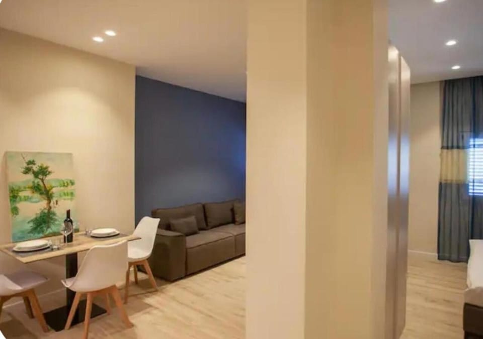 Bed, TV and multimedia, Living room, Photo of the whole room, Seating area, Dining area, Bedroom