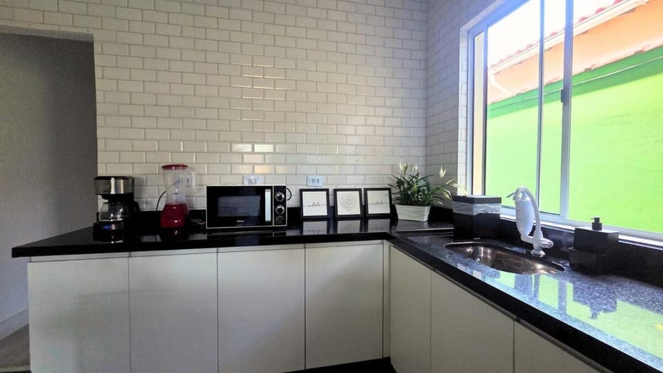House with barbecue, air, 2 parking spaces 600m from the sea House in State of São Paulo