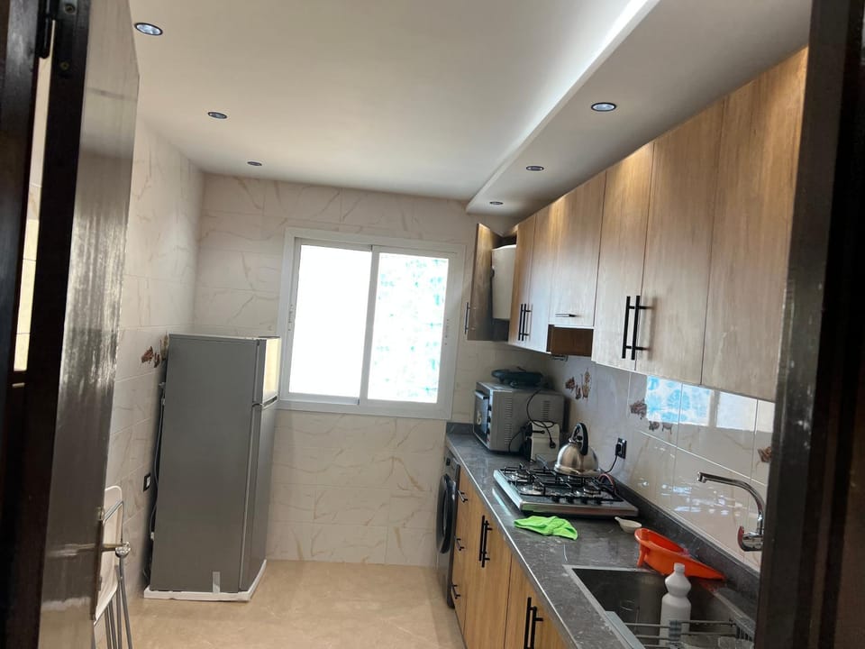 Kitchen or kitchenette, dishwasher, oven, stove