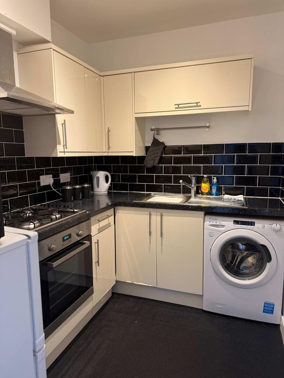 Kitchen or kitchenette, stove, toaster, washing machine, dryer