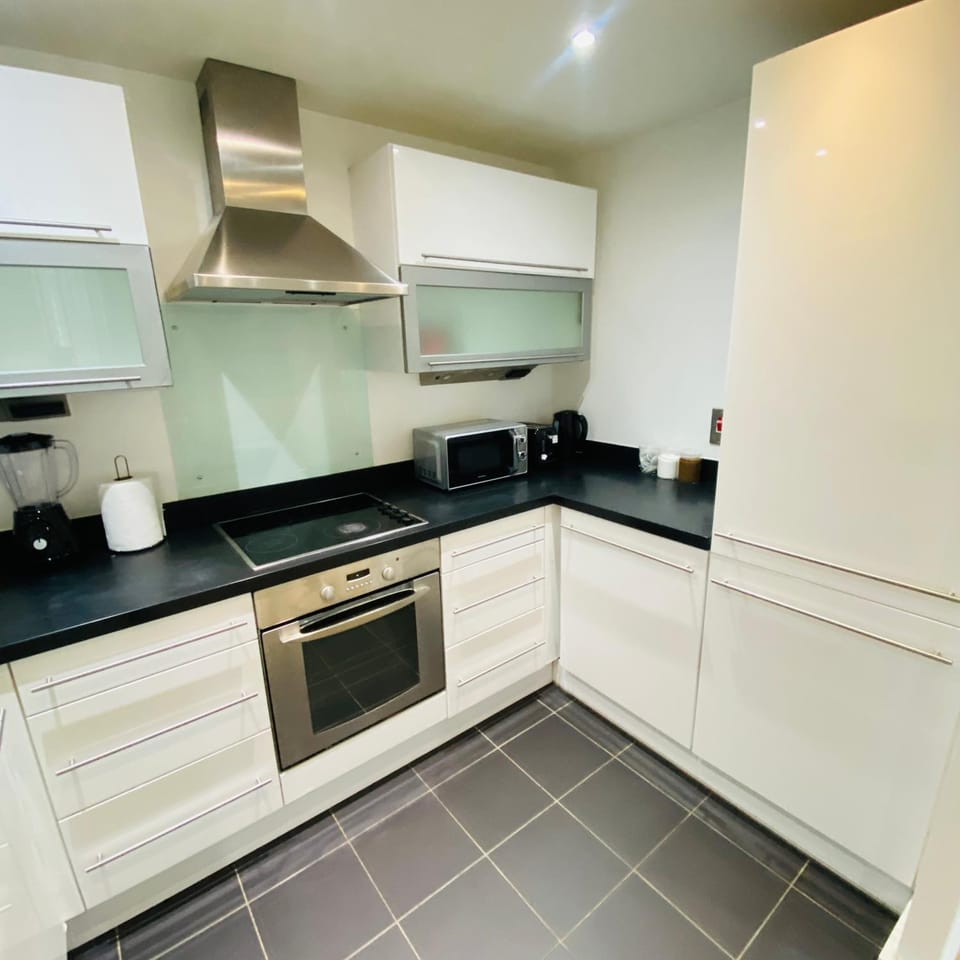 Kitchen or kitchenette, dishwasher, microwave, oven, toaster