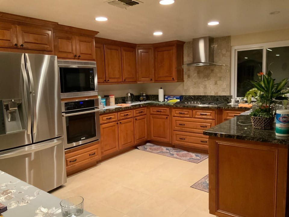 Kitchen or kitchenette, dishwasher, oven, stove