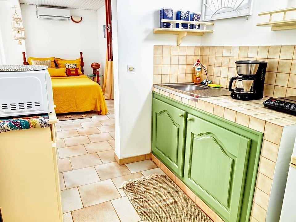 Kitchen or kitchenette, stove, toaster, air conditioner