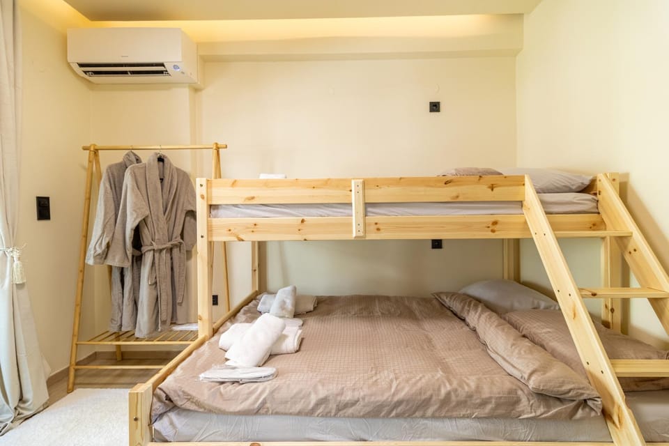 Bed, Photo of the whole room, Bedroom, bunk bed, towels, wardrobe, air conditioner