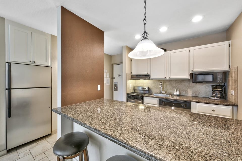 Kitchen or kitchenette, Seating area, furniture, microwave, oven, stove