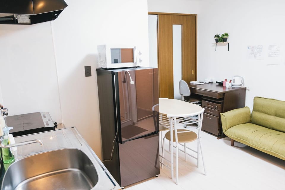 View (from property/room), Kitchen or kitchenette, Living room, Photo of the whole room, Seating area, Dining area, Bedroom, furniture, microwave