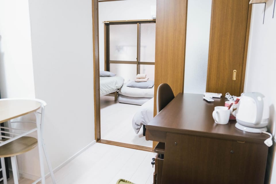 Bed, Coffee/tea facilities, View (from property/room), Seating area, Text overlay, Family, furniture, heating, internet, towels, wardrobe