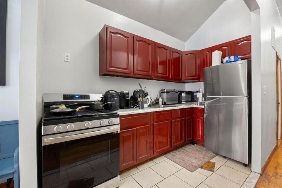Kitchen or kitchenette, dishwasher, microwave, oven, stove, toaster
