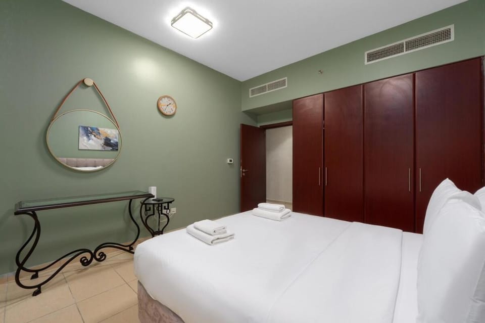 Bed, towels, wardrobe