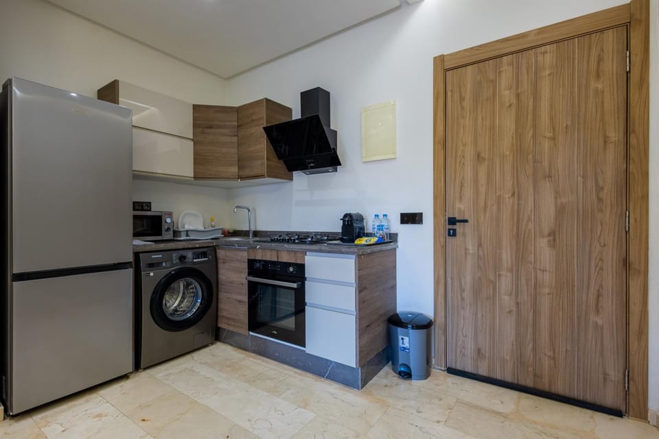 Kitchen or kitchenette, oven, stove, washing machine