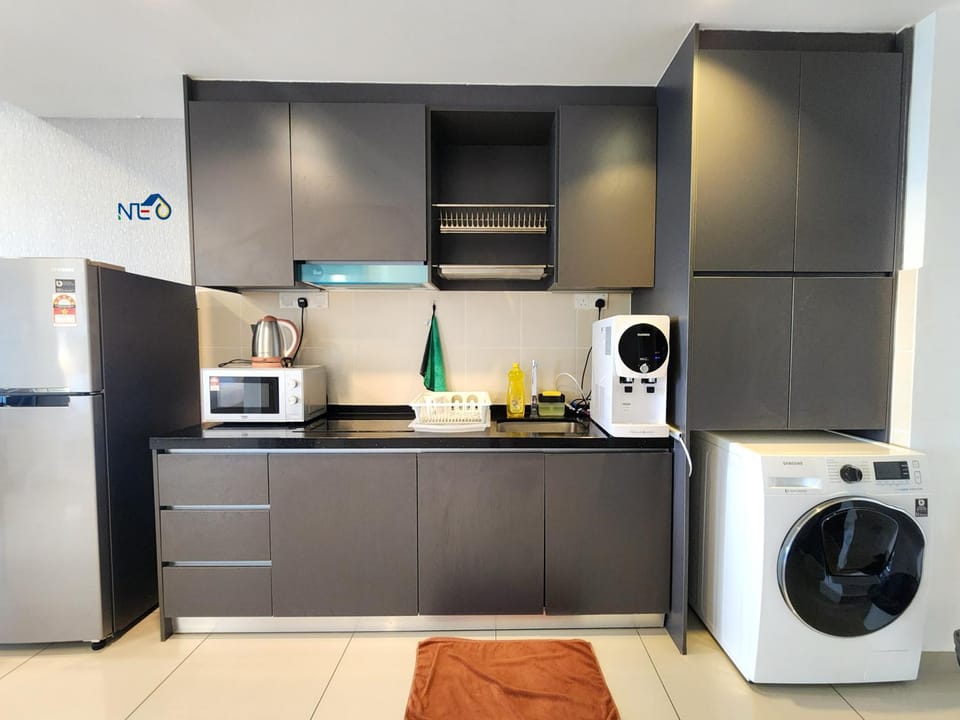 Kitchen or kitchenette, microwave, stove, washing machine
