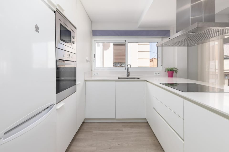 Kitchen or kitchenette, dishwasher, oven, stove