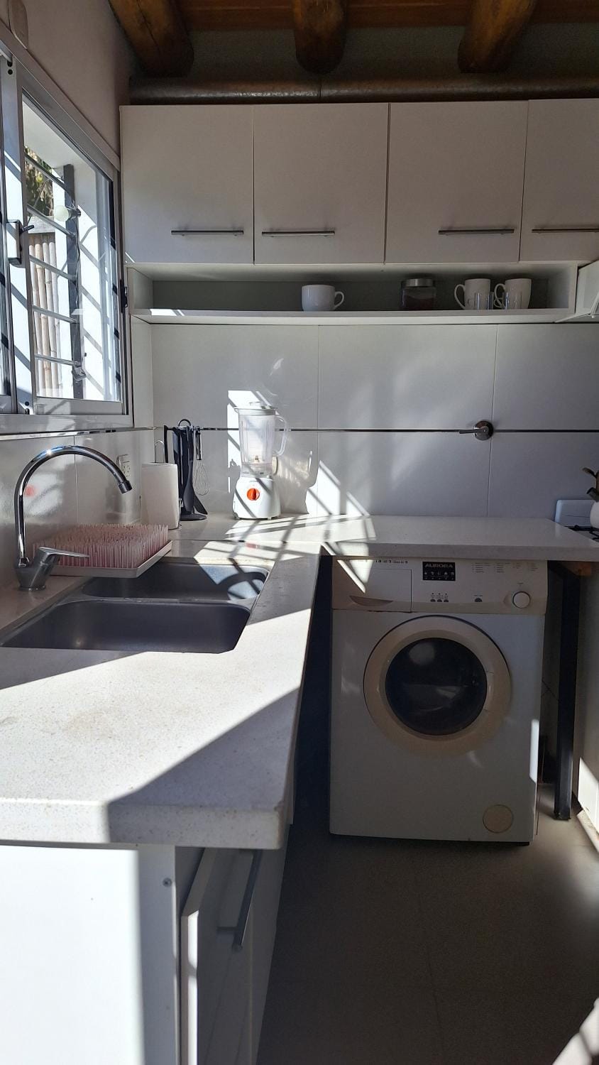 Kitchen or kitchenette, washing machine