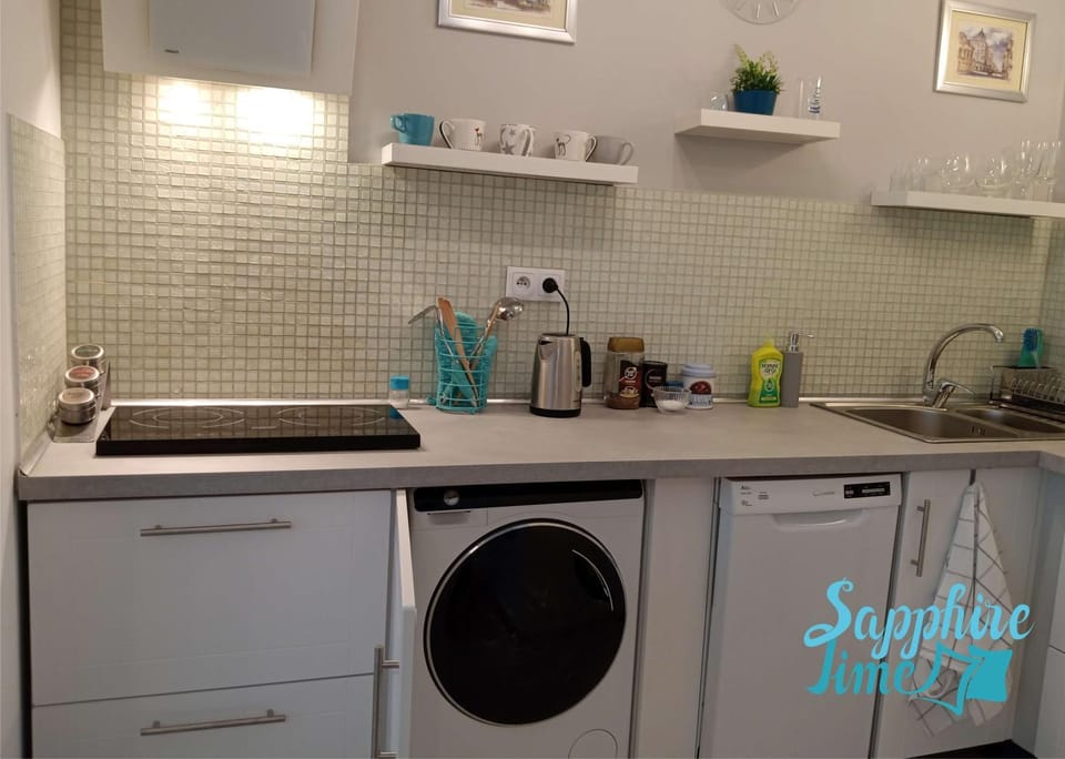 Kitchen or kitchenette, dishwasher, stove, washing machine
