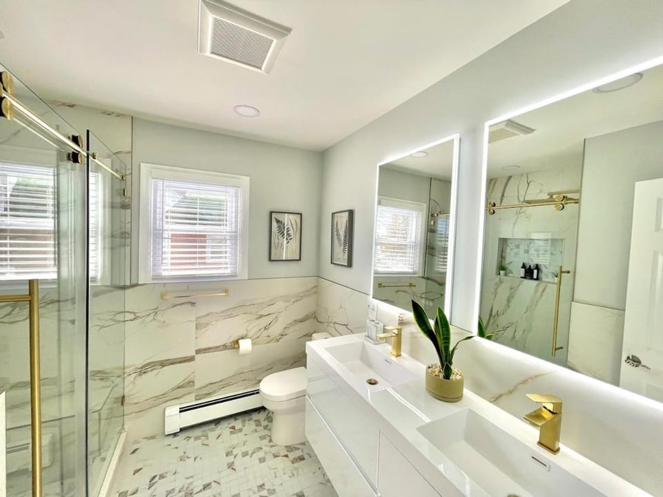Shower, Bathroom, hair dresser, hair dryier, towels, air conditioner