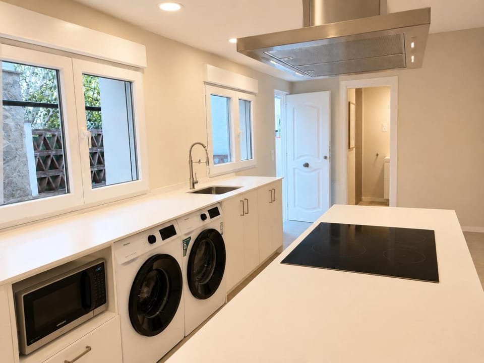 Kitchen or kitchenette, dishwasher, stove, washing machine, dryer