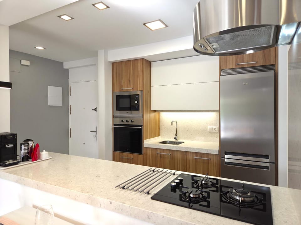 Kitchen or kitchenette, dishwasher, oven, stove, toaster