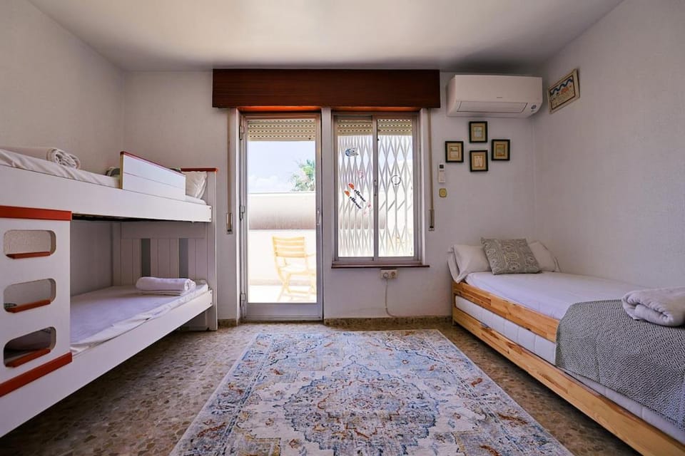 Bed, Photo of the whole room, Bedroom, bunk bed, towels, air conditioner