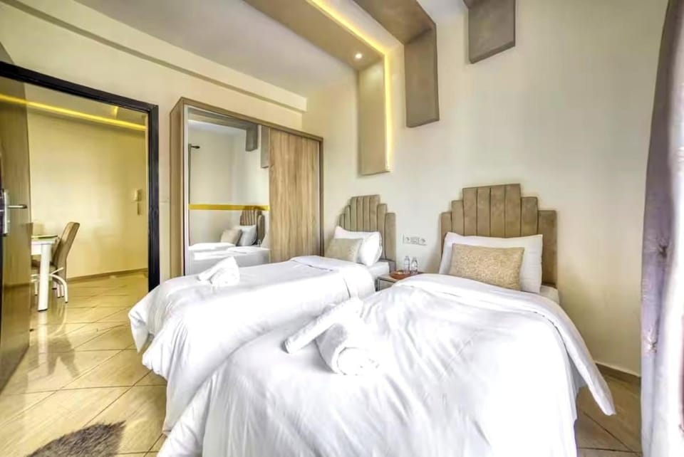 Bed, towels, wardrobe