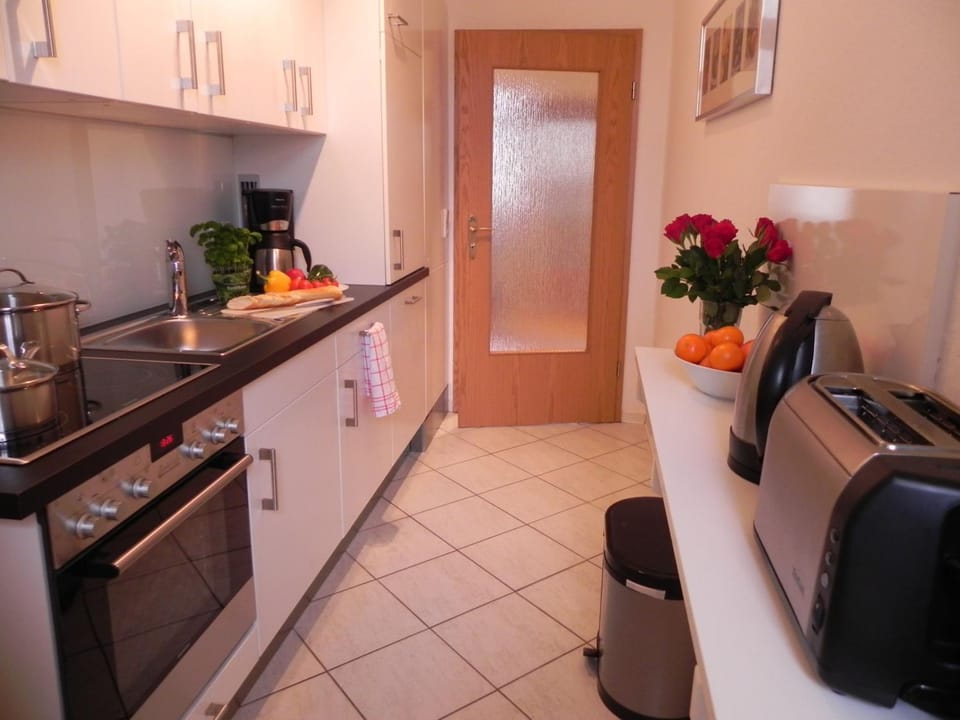 Kitchen or kitchenette, dishwasher, oven, stove, toaster