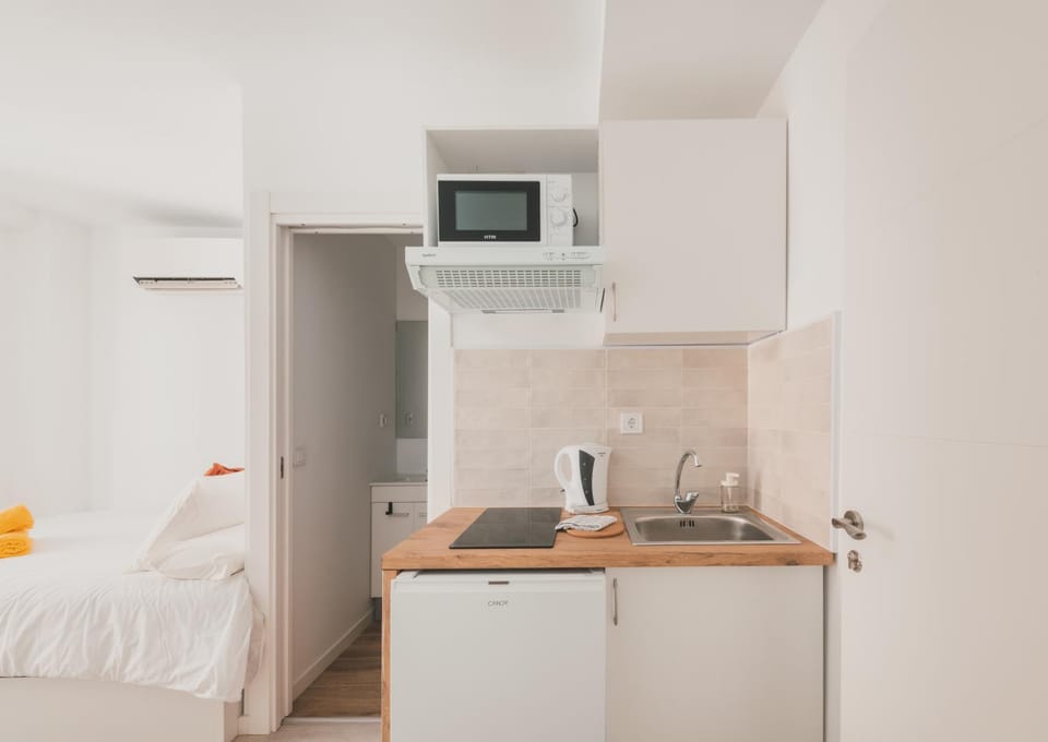 Kitchen or kitchenette, stove, air conditioner