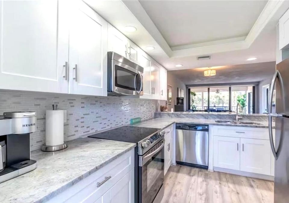 Kitchen or kitchenette, dishwasher, oven, stove