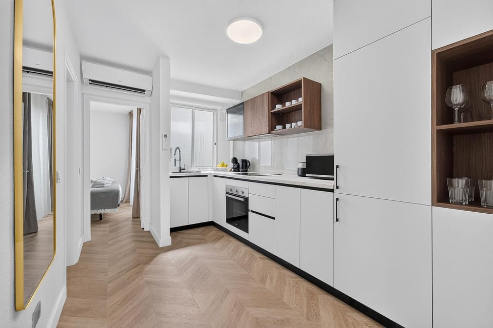 Kitchen or kitchenette, dishwasher, oven, stove, washing machine