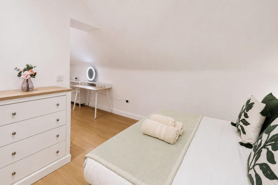 Bed, Photo of the whole room, Decorative detail, Bedroom, flat iron, hair dryier, storage, towels, wardrobe