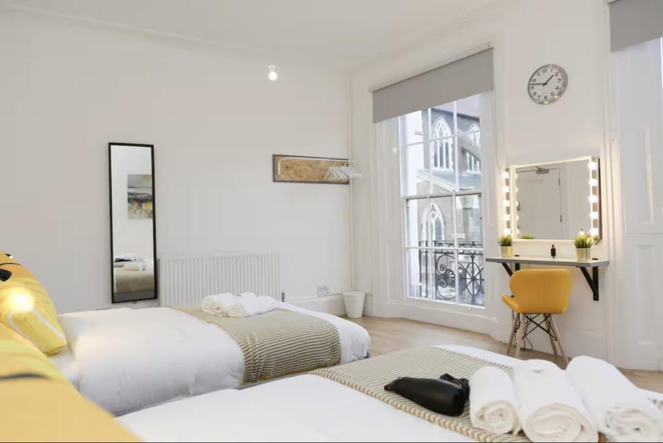 Bed, Photo of the whole room, Bedroom, hair dryier, towels