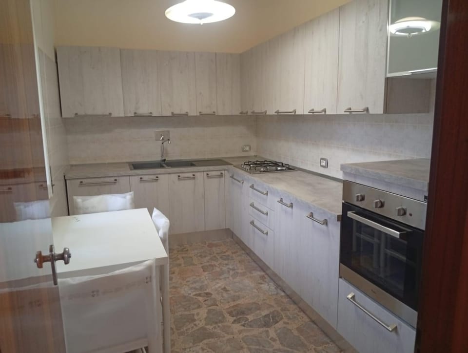 Kitchen or kitchenette, dishwasher, oven, stove