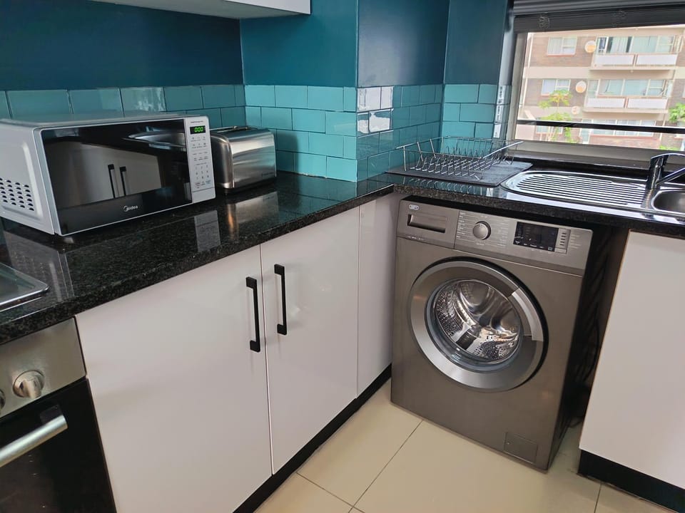 Kitchen or kitchenette, toaster, washing machine