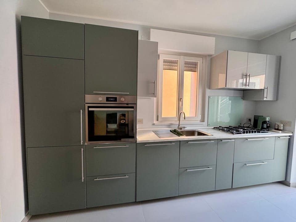 Kitchen or kitchenette, dishwasher, oven, stove