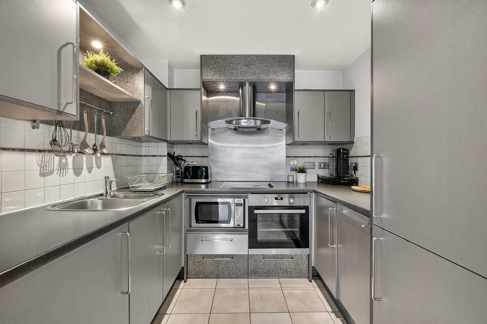 Kitchen or kitchenette, dishwasher, oven, stove, toaster