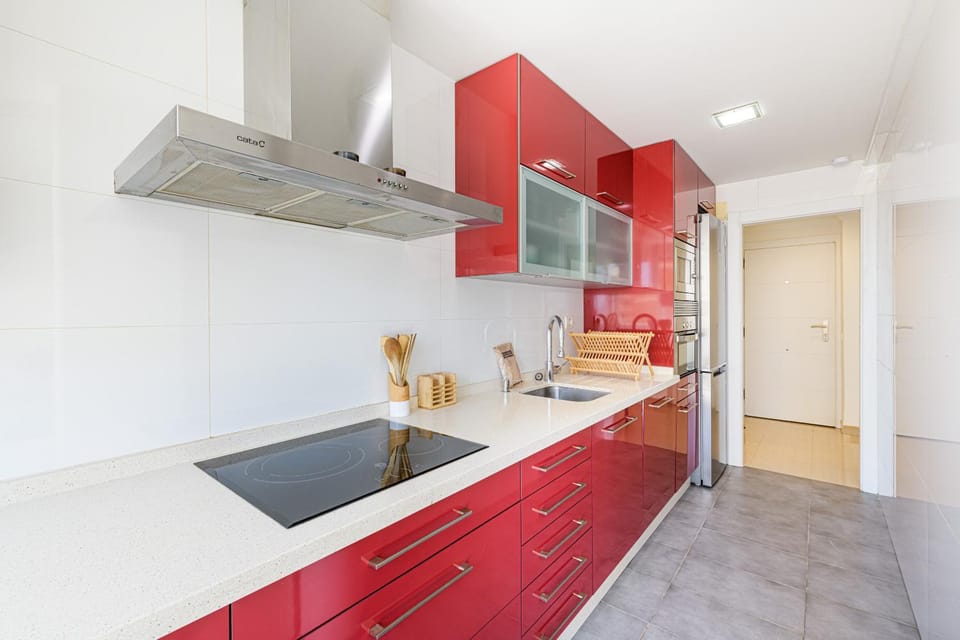 Kitchen or kitchenette, dishwasher, oven, stove