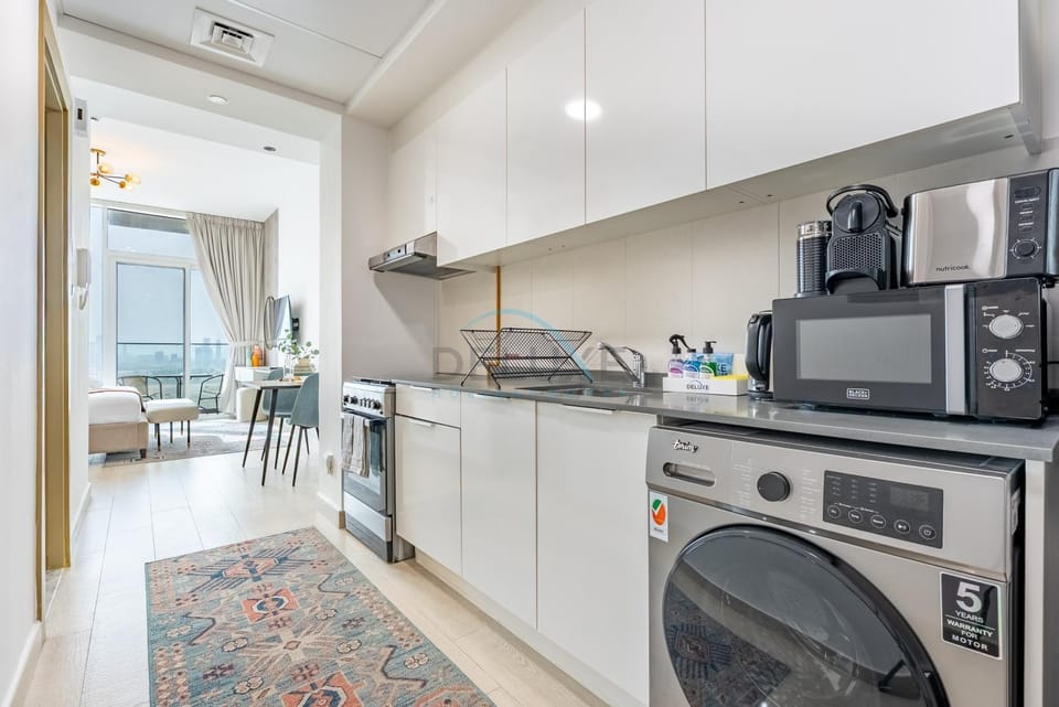 Dining area, microwave, oven, stove, toaster, washing machine, kitchen
