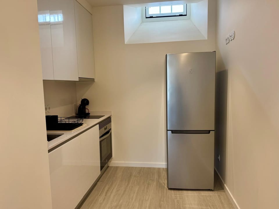 Kitchen or kitchenette, dishwasher, oven, stove, toaster