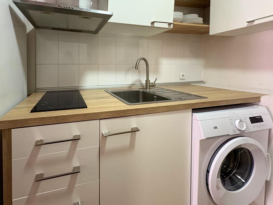 Kitchen or kitchenette, dishwasher, stove, washing machine, dryer