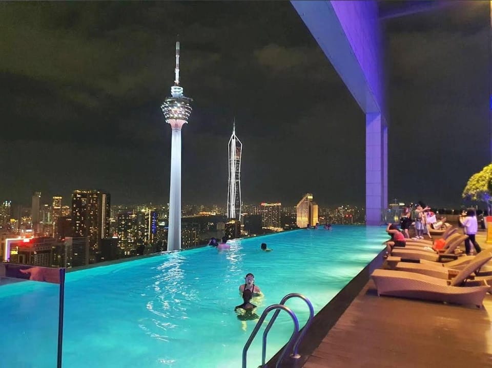 Property building, Night, People, View (from property/room), City view, Pool view, Swimming pool, group of guests