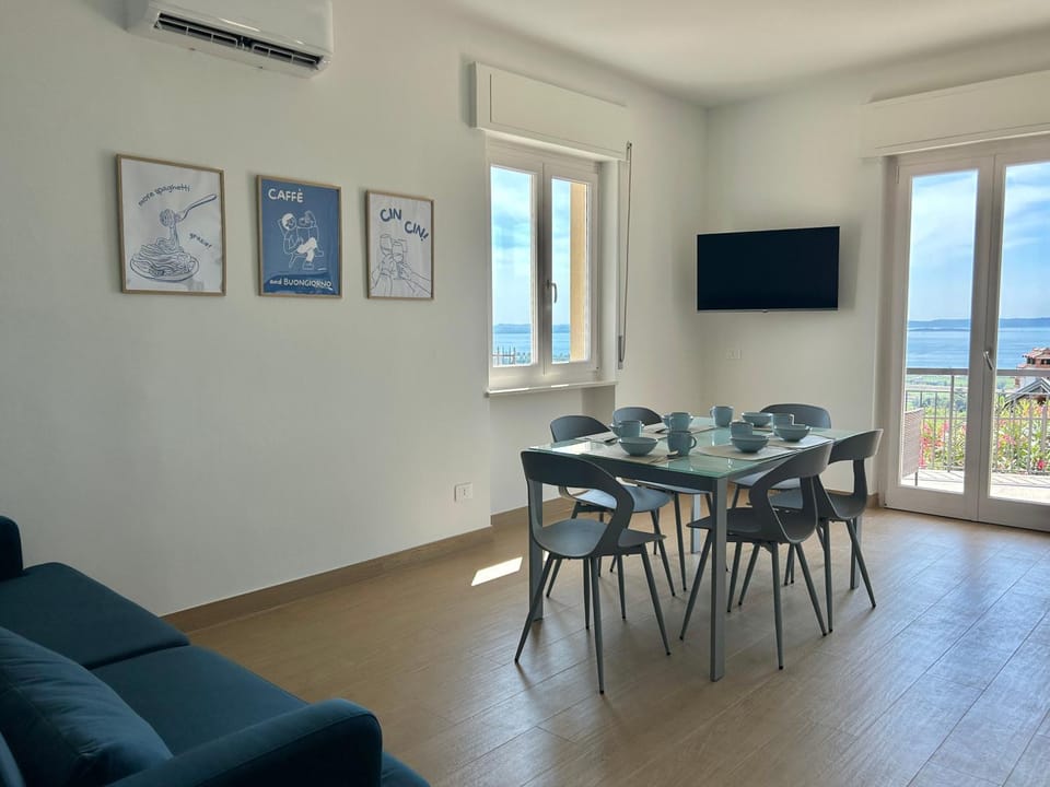 Natural landscape, TV and multimedia, Living room, Seating area, Dining area, Lake view, air conditioner