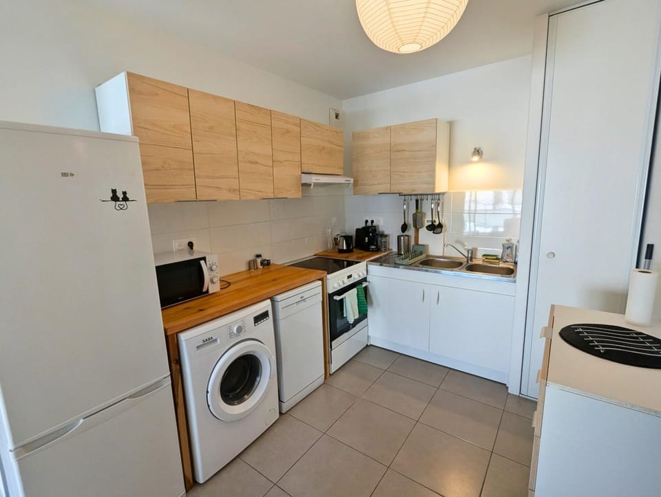 Kitchen or kitchenette, dishwasher, oven, stove, toaster, washing machine