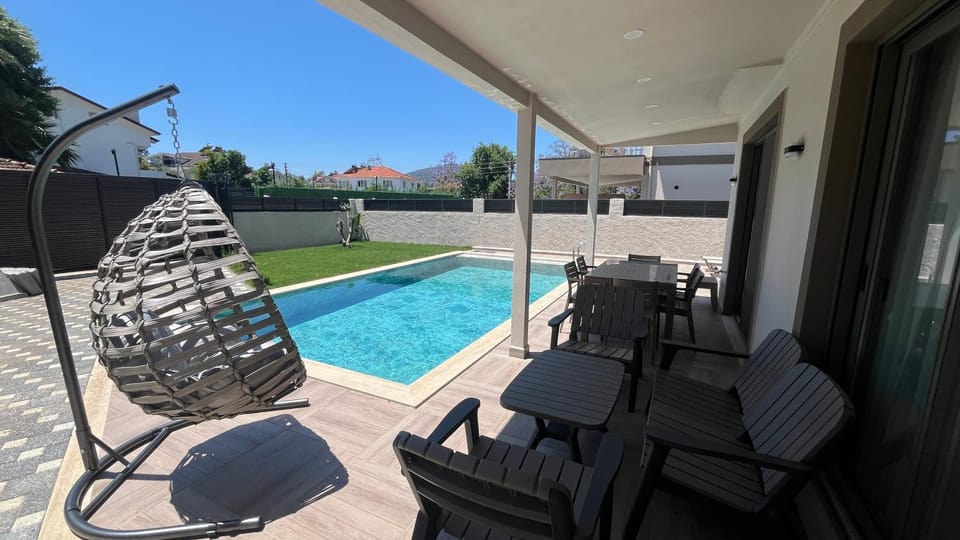 Patio, Day, Seating area, Pool view, Swimming pool, sunbed