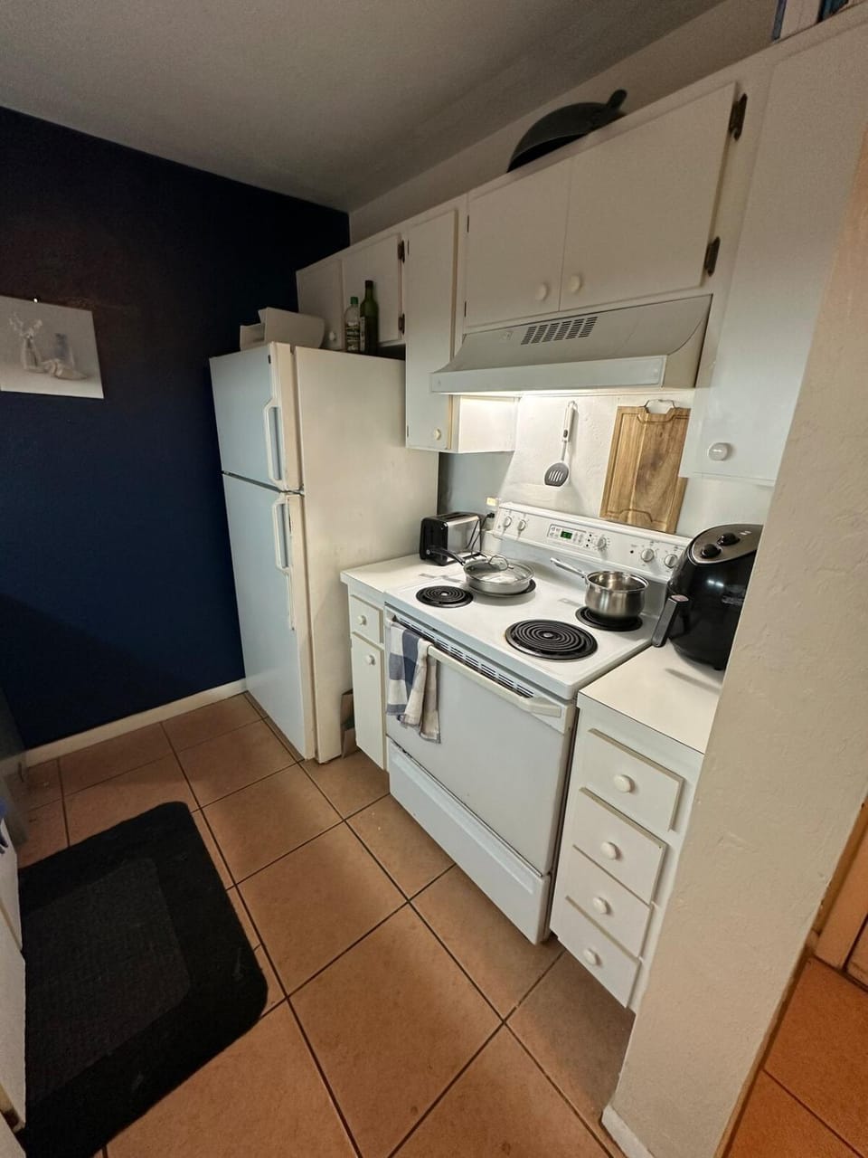 Kitchen or kitchenette, dishwasher, oven, stove, toaster