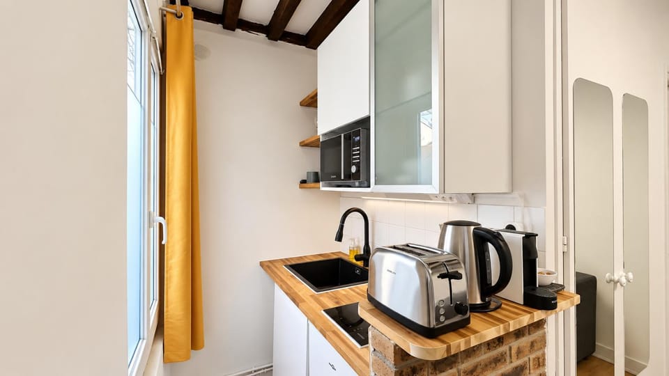 Kitchen or kitchenette, stove, toaster