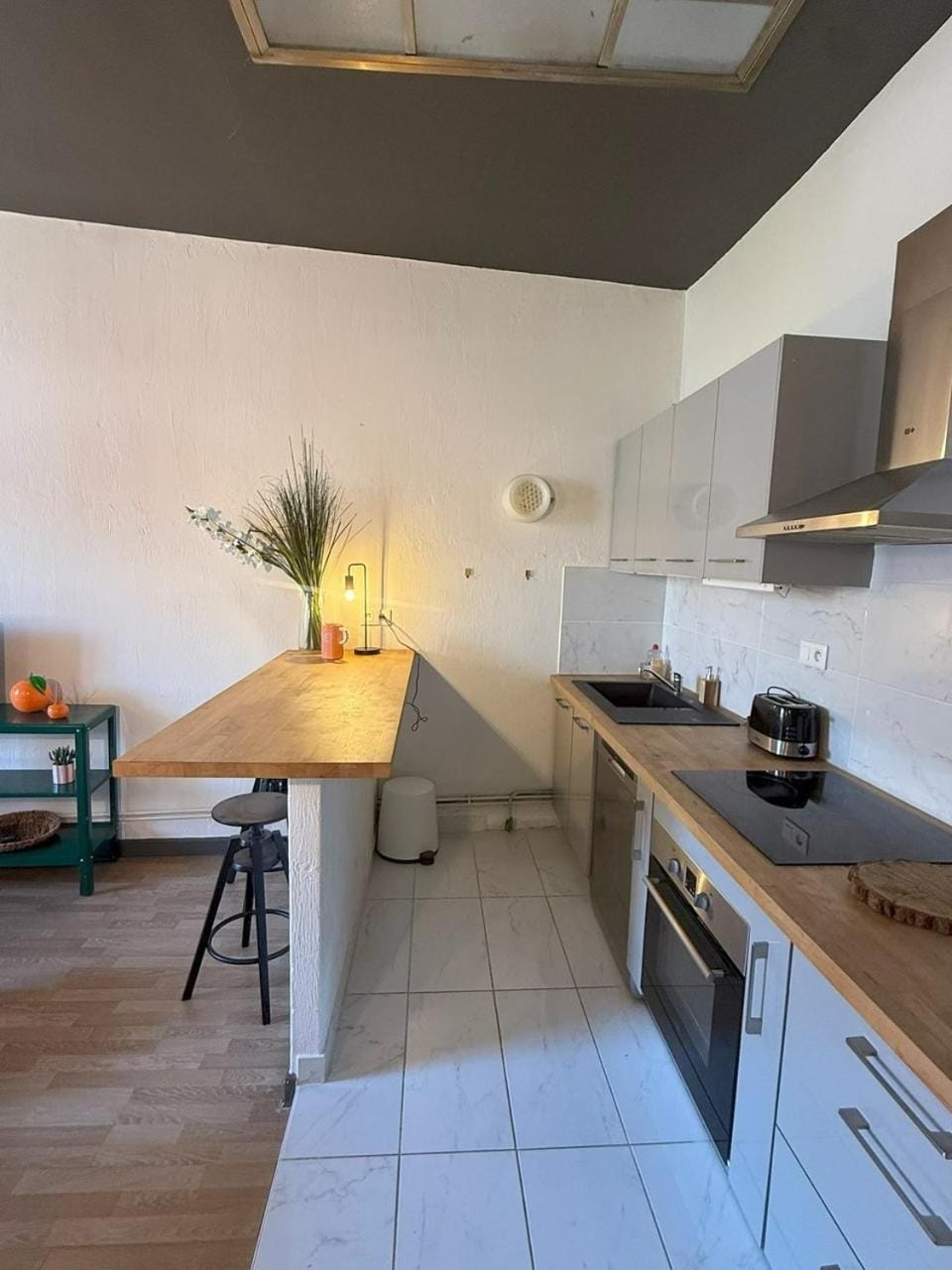 Kitchen or kitchenette, dishwasher, oven, stove, toaster