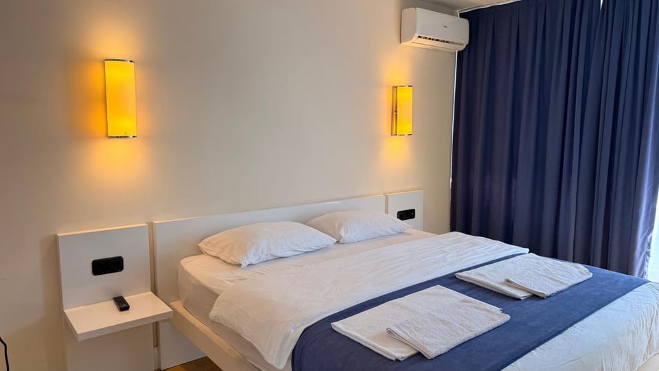 Bed, Photo of the whole room, Bedroom, towels, air conditioner