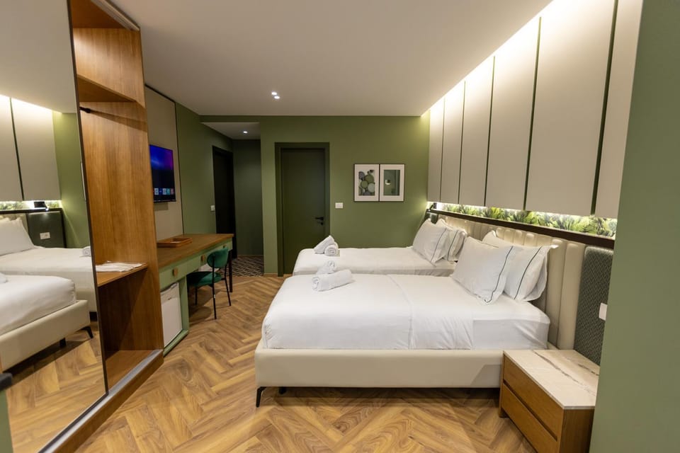 Communal lounge/ TV room, Bed, TV and multimedia, Photo of the whole room, Decorative detail, Seating area, Bedroom, furniture, minibar, wardrobe