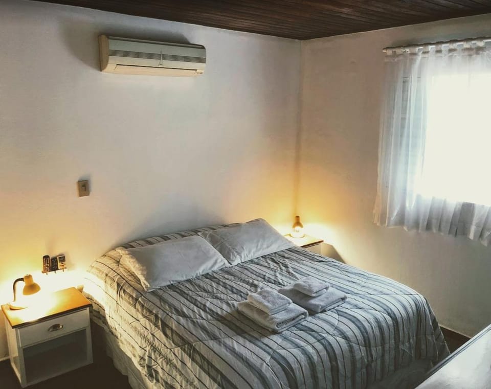 Photo of the whole room, towels, air conditioner
